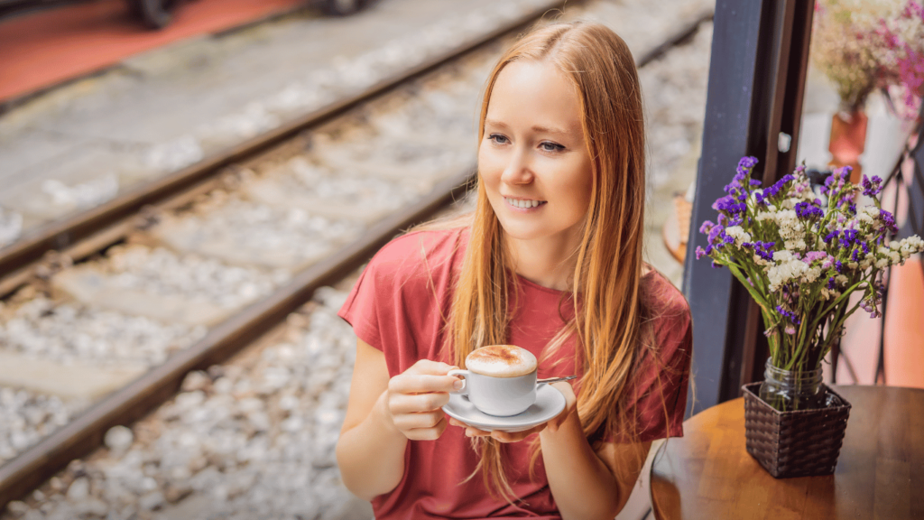 Girl sipping egg coffee in Hanoi's Train Street